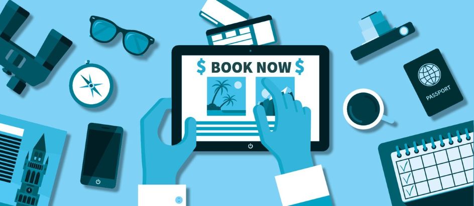 071626-blogpost-booknow-content iPad with the words "Book Now" and other vacation items