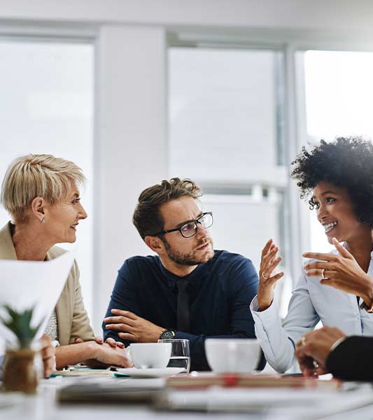 Shot of a group of businesspeople sitting together in a meeting.