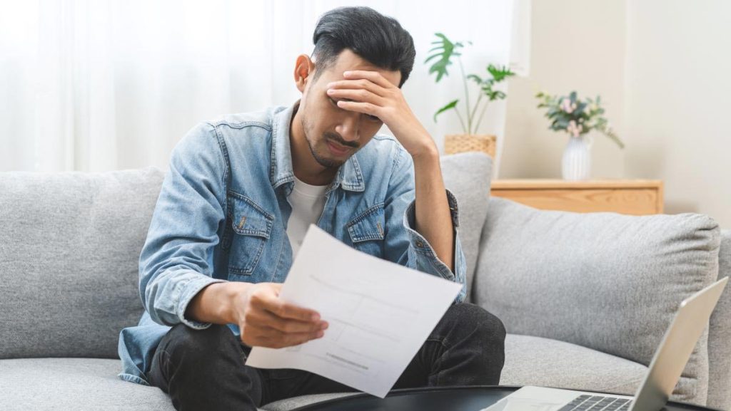 Man looking at paper