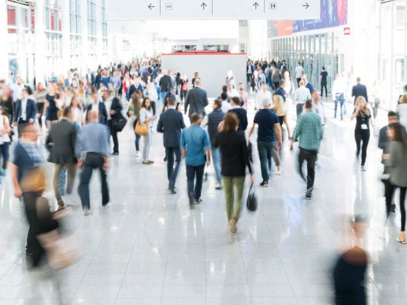 A large, busy hallway during a conference event.