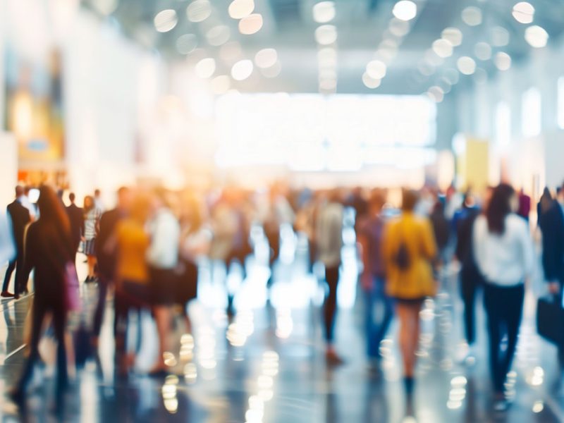 people walking in a conference hall