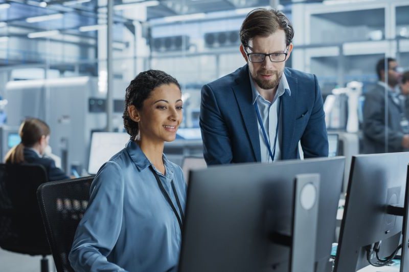 two people collaborating on the computer
