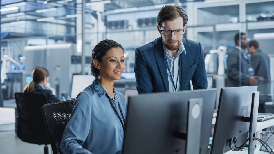 two people collaborating on the computer
