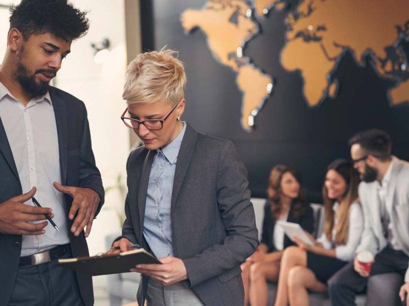 Two people looking at a tablet
