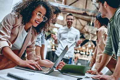 Group of people working together around a table