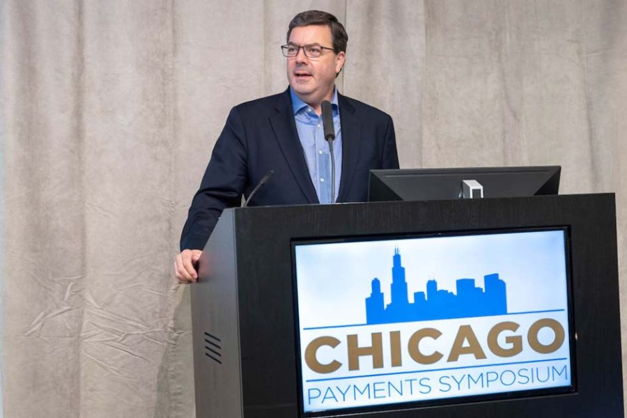 Mark Gould, Chief Payments Executive of Federal Reserve Financial Services, introduces Chicago Payments Symposium keynote speaker Amy Webb.
