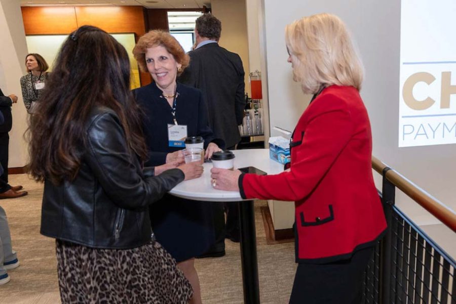 Federal Reserve Bank of Cleveland President and CEO Loretta Mester (center) with fellow attendees at the Chicago Payments Symposium.