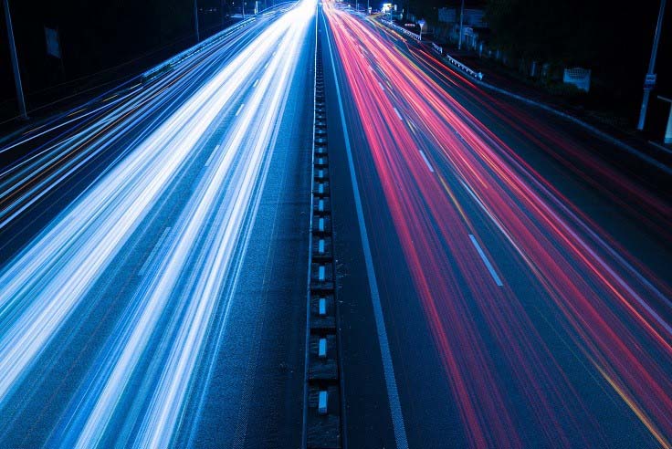 speeding cars on a highway
