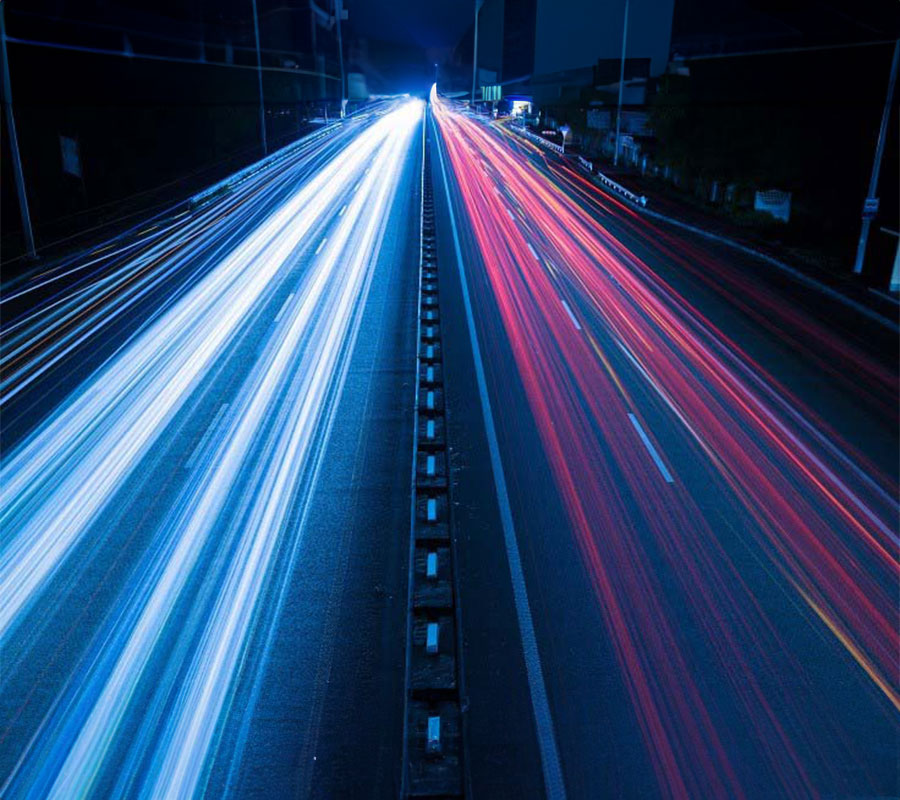 speeding cars on a highway